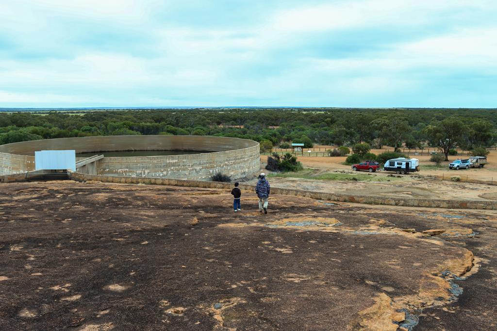 People walking on top of Beringbooding Rock in the Wheatbelt