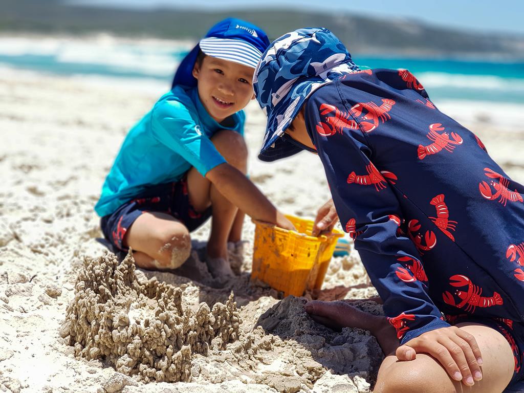 Kids playing with the sand at Boat Harbour