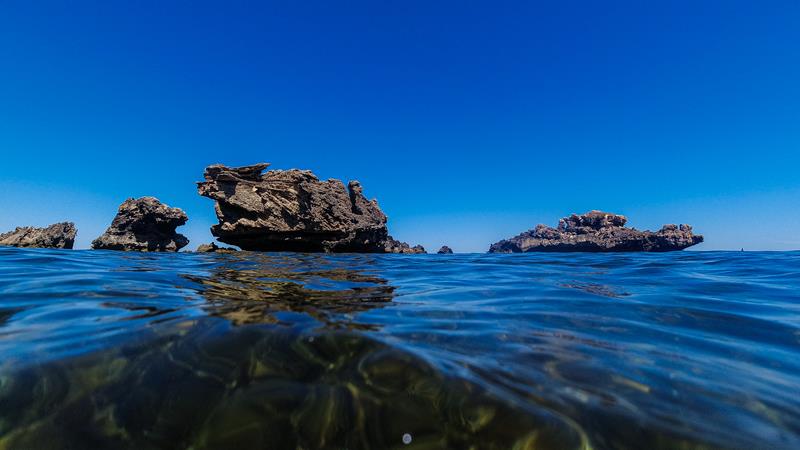Limestone rock above clear sea water and corals below at Cape Peron (Rockingham)