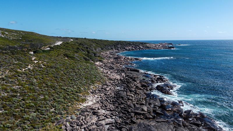 View of coastal cliffs near blue ocean