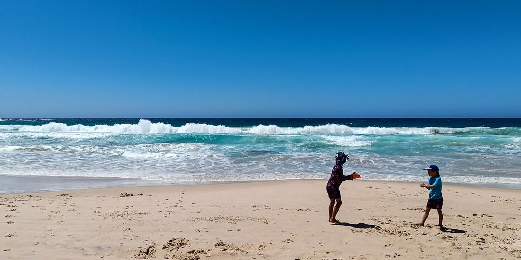 Kids playing on the sand at Boat Harbour beach