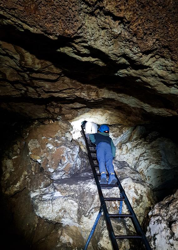 Climbing vertical ladder at Giants Cave in Leeuwin Naturaliste National Park