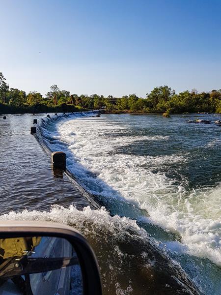 Driving through the water along Ivanoe River Crossing
