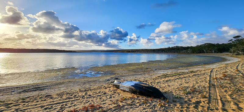 Small boat on the shore of Beaufort Inlet at Millers Point campground