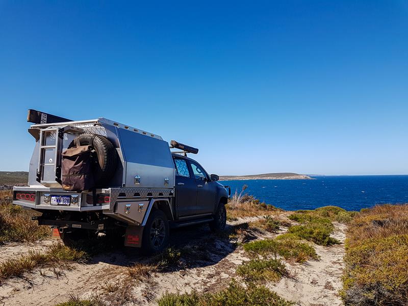 Ute with a canopy driving to Point Henry at Bremer Bay