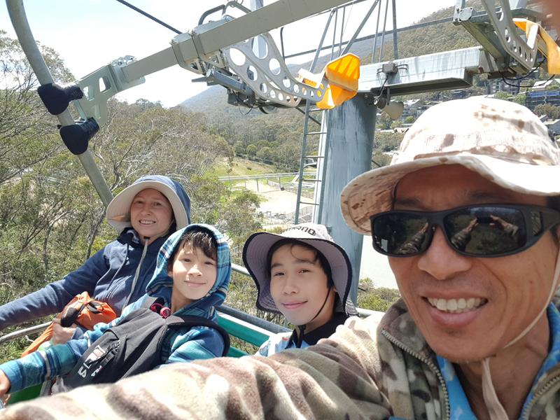Family of 4 on a chair lift at Kosciuszko National Park
