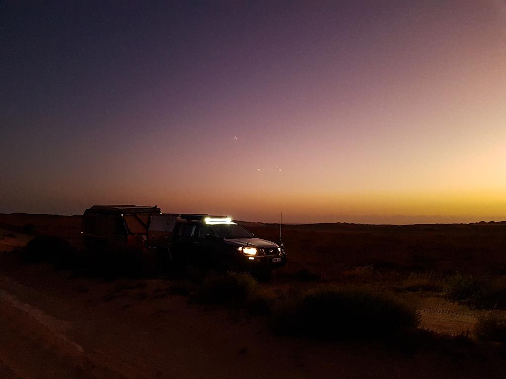 Vehicle stopped on Cardabia Ningaloo Road at Nyinggulara National Park.
