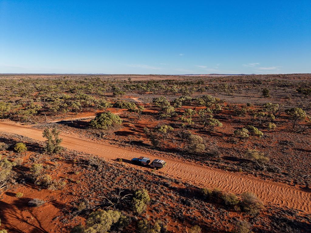 A vehicle with a van travelling through Lake Gairdner NP